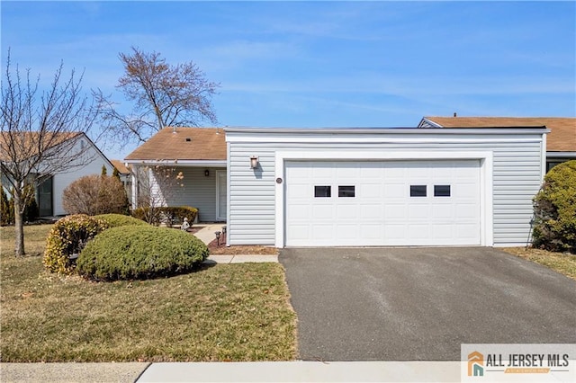 33 Haddon Rd Unit 33A, Monroe, NJ 08831 - view of front facade featuring an attached garage, driveway, and a front lawn