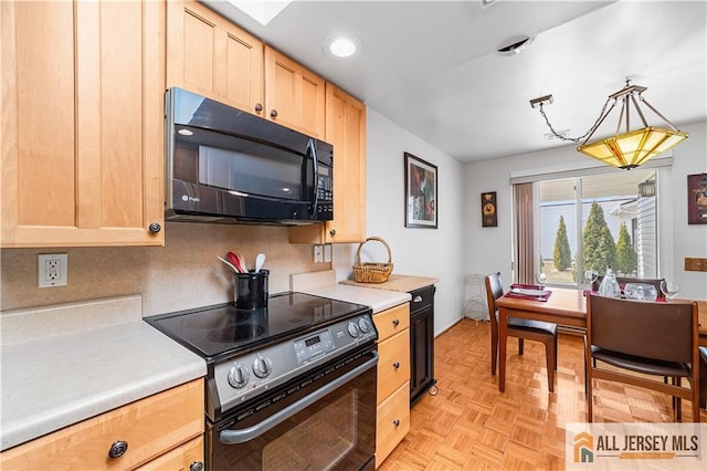 kitchen with light brown cabinetry, hanging light fixtures, black appliances, light countertops, and tasteful backsplash