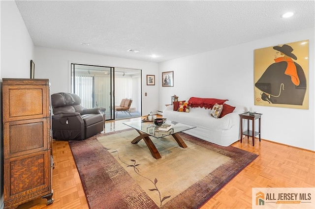 living room featuring a textured ceiling