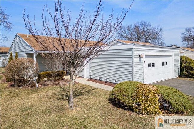 33 Haddon Rd Unit 33A, Monroe, NJ 08831 - view of side of property with a garage, a yard, and asphalt driveway