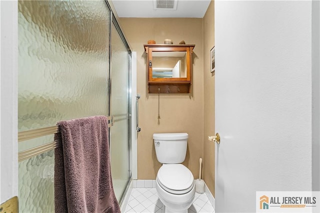 full bath featuring visible vents, toilet, a shower stall, and tile patterned flooring