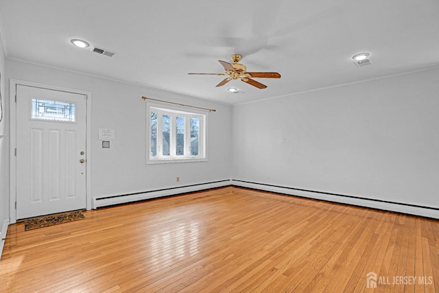 foyer entrance with ceiling fan, light hardwood / wood-style flooring, and crown molding