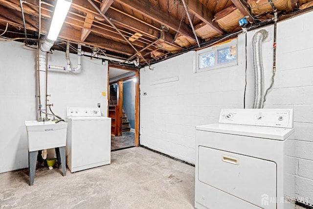 clothes washing area featuring independent washer and dryer