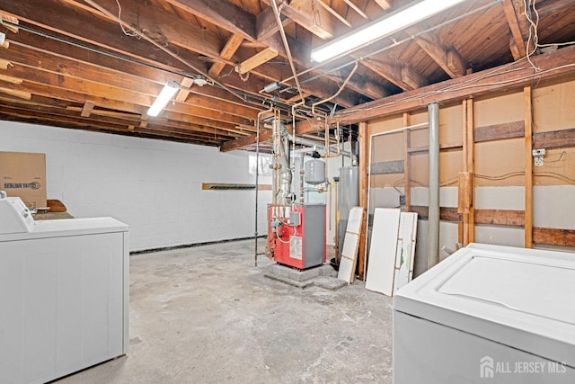 basement with gas water heater and separate washer and dryer