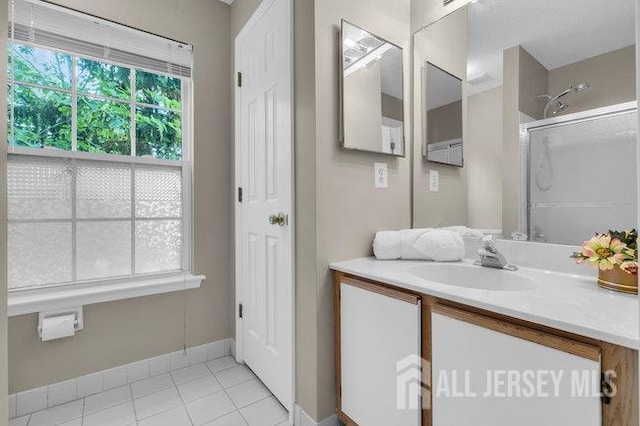 84 Prestwick Way, Edison, NJ 08820 - bathroom with vanity, tile patterned flooring, a shower, and baseboards