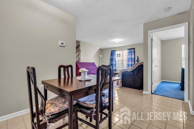 84 Prestwick Way, Edison, NJ 08820 - dining space with baseboards, a textured ceiling, and light tile patterned flooring