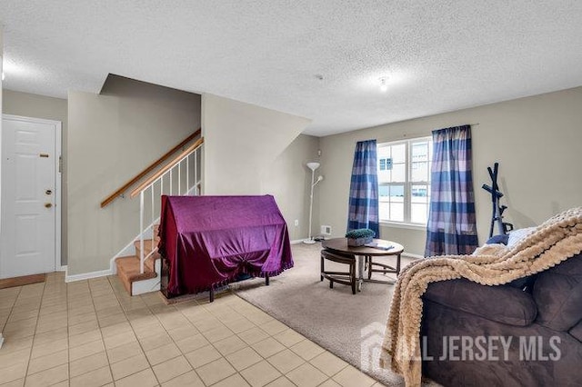 84 Prestwick Way, Edison, NJ 08820 - living room featuring a textured ceiling, stairway, tile patterned floors, and baseboards