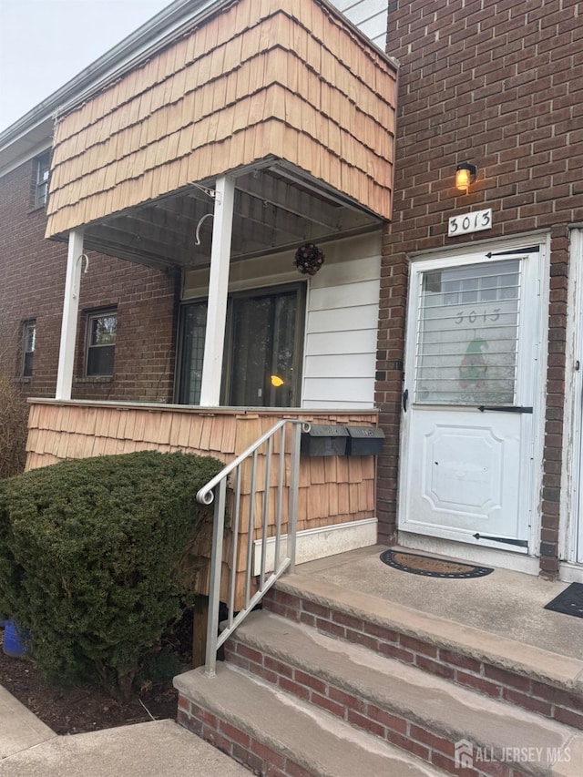 3013 Cromwell Ct, Hillsborough, NJ 08844 - property entrance featuring mansard roof and brick siding