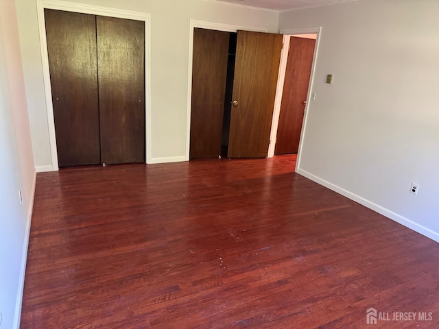 3013 Cromwell Ct, Hillsborough, NJ 08844 - unfurnished bedroom with two closets, wood finished floors, baseboards, and crown molding