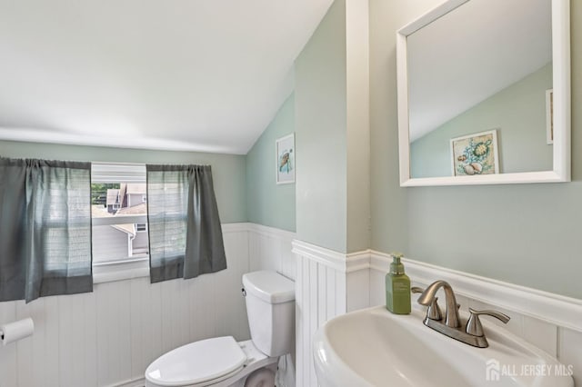 30 Clark Pl, Avenel, NJ 07001 - bathroom with vaulted ceiling and a wainscoted wall