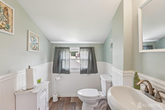 30 Clark Pl, Avenel, NJ 07001 - half bathroom with wainscoting, wood finished floors, and lofted ceiling