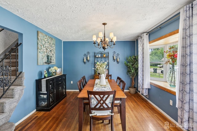 30 Clark Pl, Avenel, NJ 07001 - dining room with stairway, a textured ceiling, hardwood / wood-style floors, and a chandelier