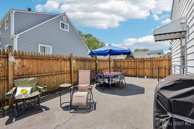30 Clark Pl, Avenel, NJ 07001 - fenced backyard with outdoor dining area, a patio, and area for grilling