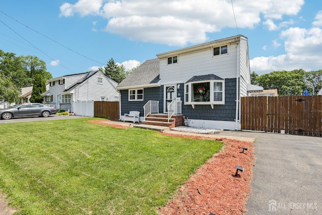 30 Clark Pl, Avenel, NJ 07001 - view of front facade with a shingled roof