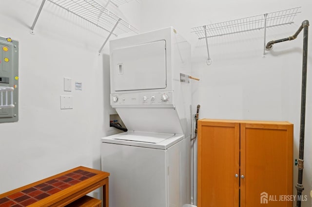 540 Cranbury Rd Unit 107, East Brunswick, NJ 08816 - laundry area with stacked washer / drying machine and electric panel