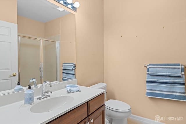 540 Cranbury Rd Unit 107, East Brunswick, NJ 08816 - bathroom featuring a stall shower, vanity, and toilet