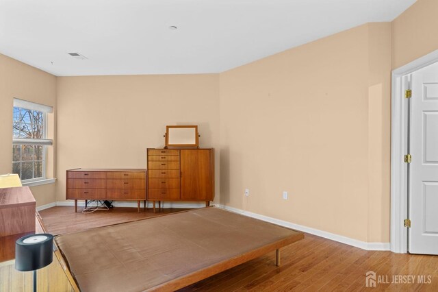 bedroom featuring wood-type flooring