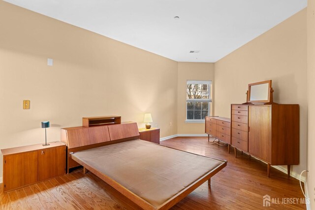 bedroom featuring hardwood / wood-style floors