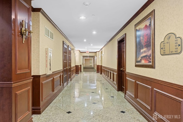 540 Cranbury Rd Unit 107, East Brunswick, NJ 08816 - corridor with a decorative wall, granite tiled floors, ornamental molding, and a wainscoted wall