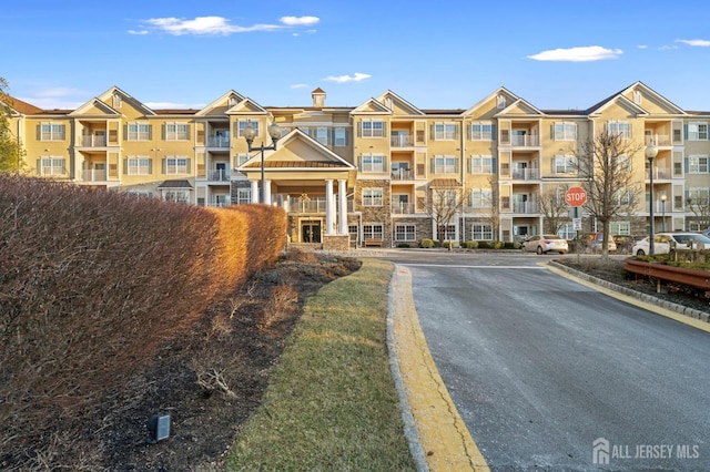 540 Cranbury Rd Unit 107, East Brunswick, NJ 08816 - view of apartment building / complex with uncovered parking