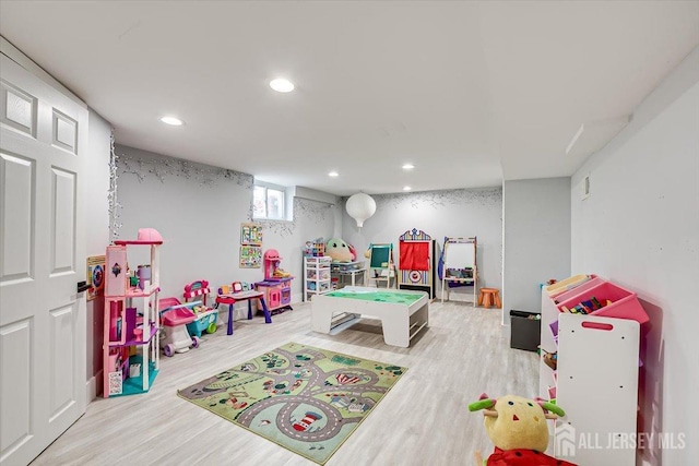 recreation room featuring light wood-type flooring