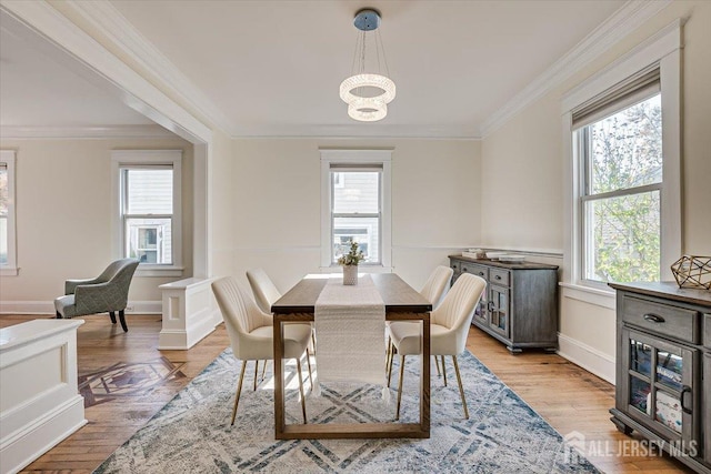 dining area featuring a wealth of natural light and light hardwood / wood-style flooring