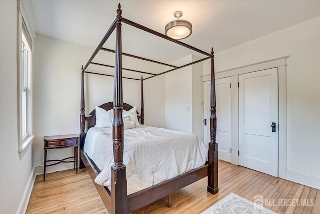 bedroom with a closet and light wood-type flooring