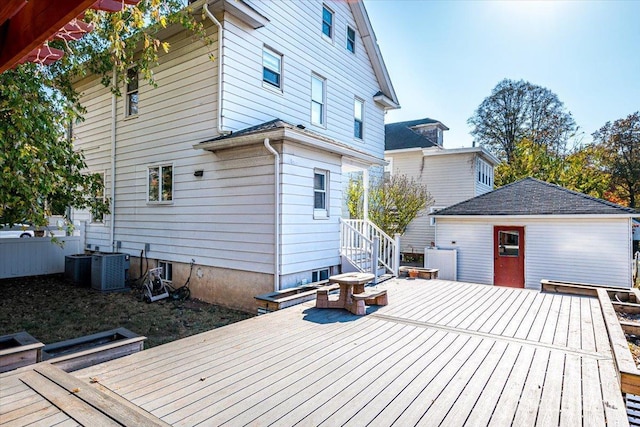 deck with cooling unit and an outbuilding