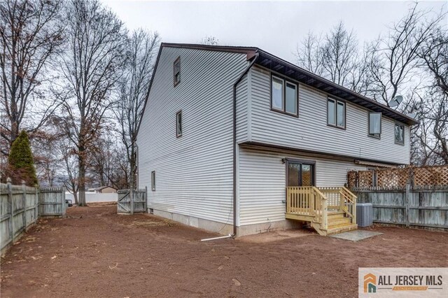 back of property with central AC unit