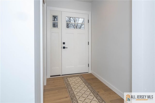 doorway featuring hardwood / wood-style flooring