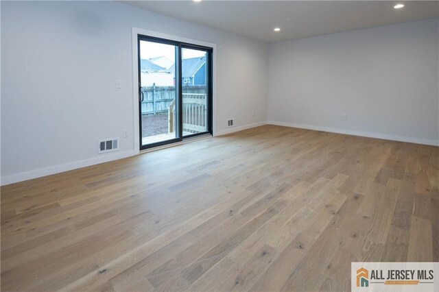 unfurnished room featuring light hardwood / wood-style flooring