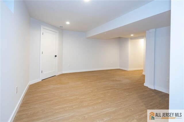 basement featuring light hardwood / wood-style flooring