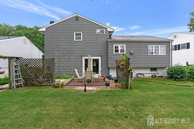 38 Foothills Dr, South River, NJ 08882 - back of property featuring a lawn, a patio area, and a chimney