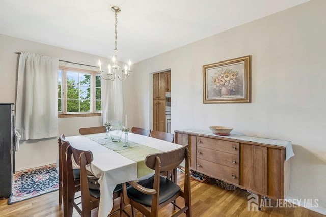 38 Foothills Dr, South River, NJ 08882 - dining area featuring a chandelier and light wood finished floors