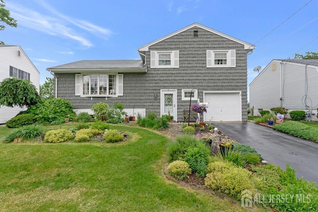 38 Foothills Dr, South River, NJ 08882 - tri-level home with an attached garage, driveway, and a front lawn