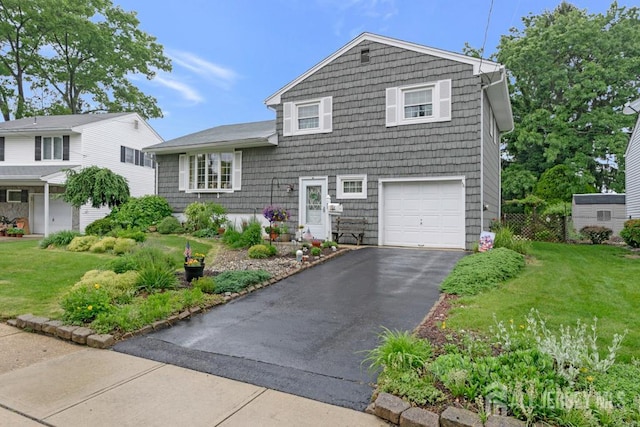 38 Foothills Dr, South River, NJ 08882 - split level home with an attached garage, a front yard, and asphalt driveway