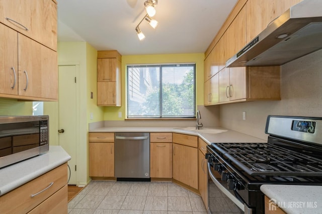 172 Sayre Dr, Plainsboro, NJ 08540 - kitchen with stainless steel appliances, under cabinet range hood, a sink, light countertops, and light brown cabinets