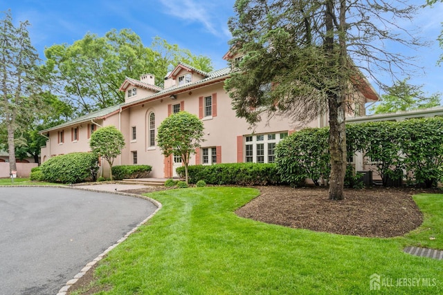 172 Sayre Dr, Plainsboro, NJ 08540 - mediterranean / spanish-style home with stucco siding and a front lawn