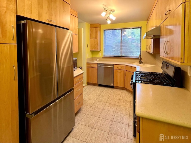172 Sayre Dr, Plainsboro, NJ 08540 - kitchen with stainless steel appliances, ventilation hood, light countertops, a sink, and light tile patterned floors