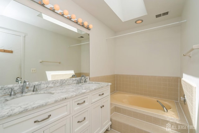 172 Sayre Dr, Plainsboro, NJ 08540 - full bath featuring a garden tub, a skylight, and double vanity