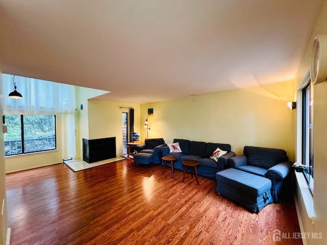 172 Sayre Dr, Plainsboro, NJ 08540 - living area with wood finished floors and a fireplace