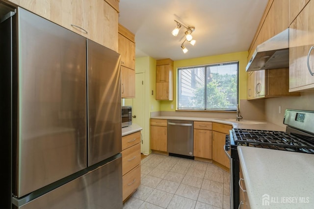 172 Sayre Dr, Plainsboro, NJ 08540 - kitchen with stainless steel appliances, extractor fan, light countertops, light brown cabinets, and a sink