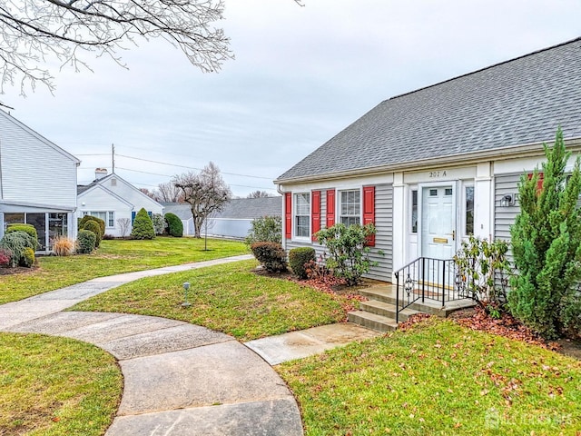 view of front of home with a front lawn