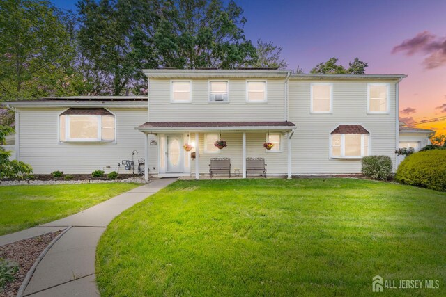 15 Creighton Cir, Old Bridge, NJ 08857 - view of front of house featuring a front lawn and a porch