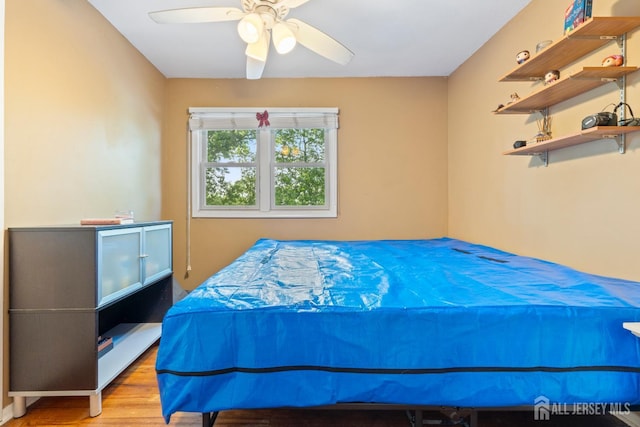15 Creighton Cir, Old Bridge, NJ 08857 - bedroom with wood finished floors and a ceiling fan