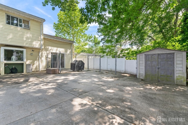 15 Creighton Cir, Old Bridge, NJ 08857 - view of patio with a storage unit and area for grilling