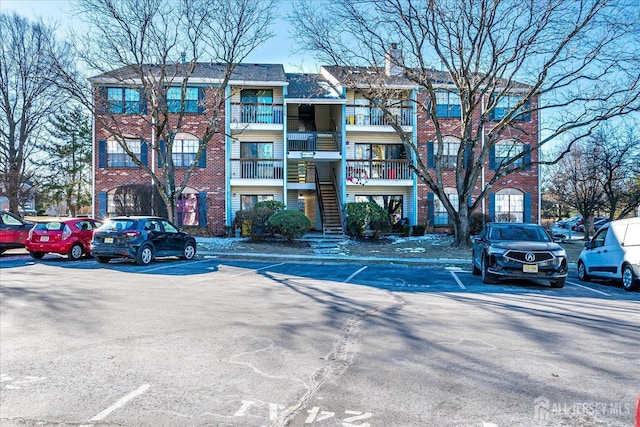 446 Danbury Ln, East Brunswick, NJ 08816 - view of property with uncovered parking and stairs
