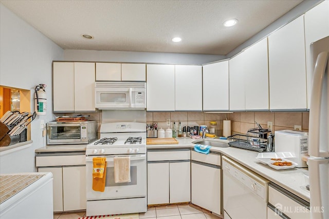 446 Danbury Ln, East Brunswick, NJ 08816 - kitchen featuring white appliances, light countertops, backsplash, white cabinets, and recessed lighting