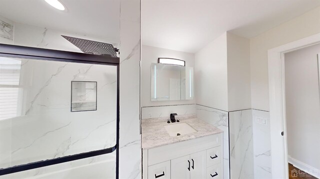 bathroom featuring vanity and walk in shower