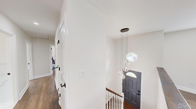 hallway with dark hardwood / wood-style floors